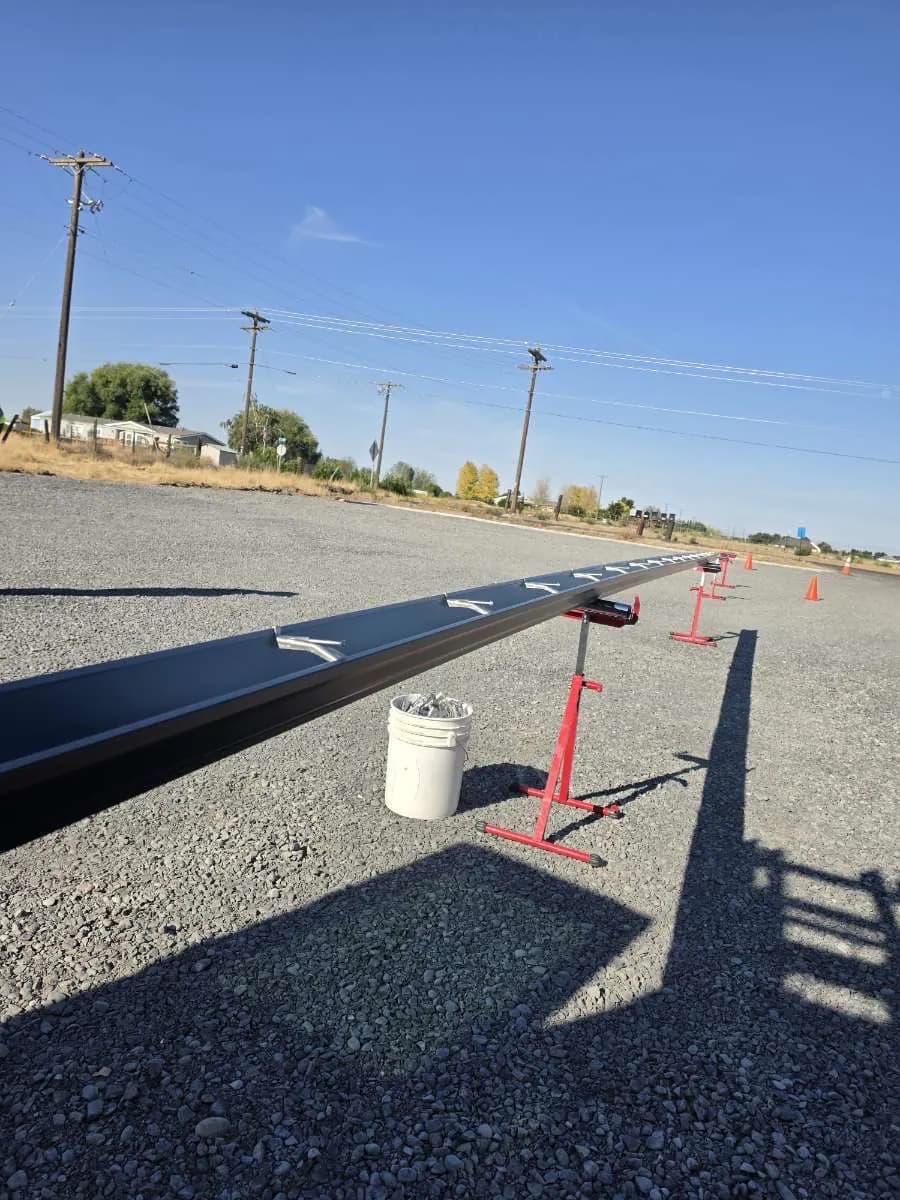 Dark gutter run on roller stands, ready to hang