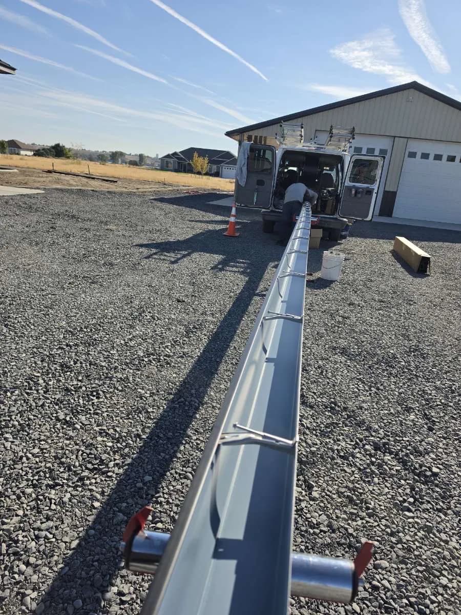 A single long gutter run coming straight off the van